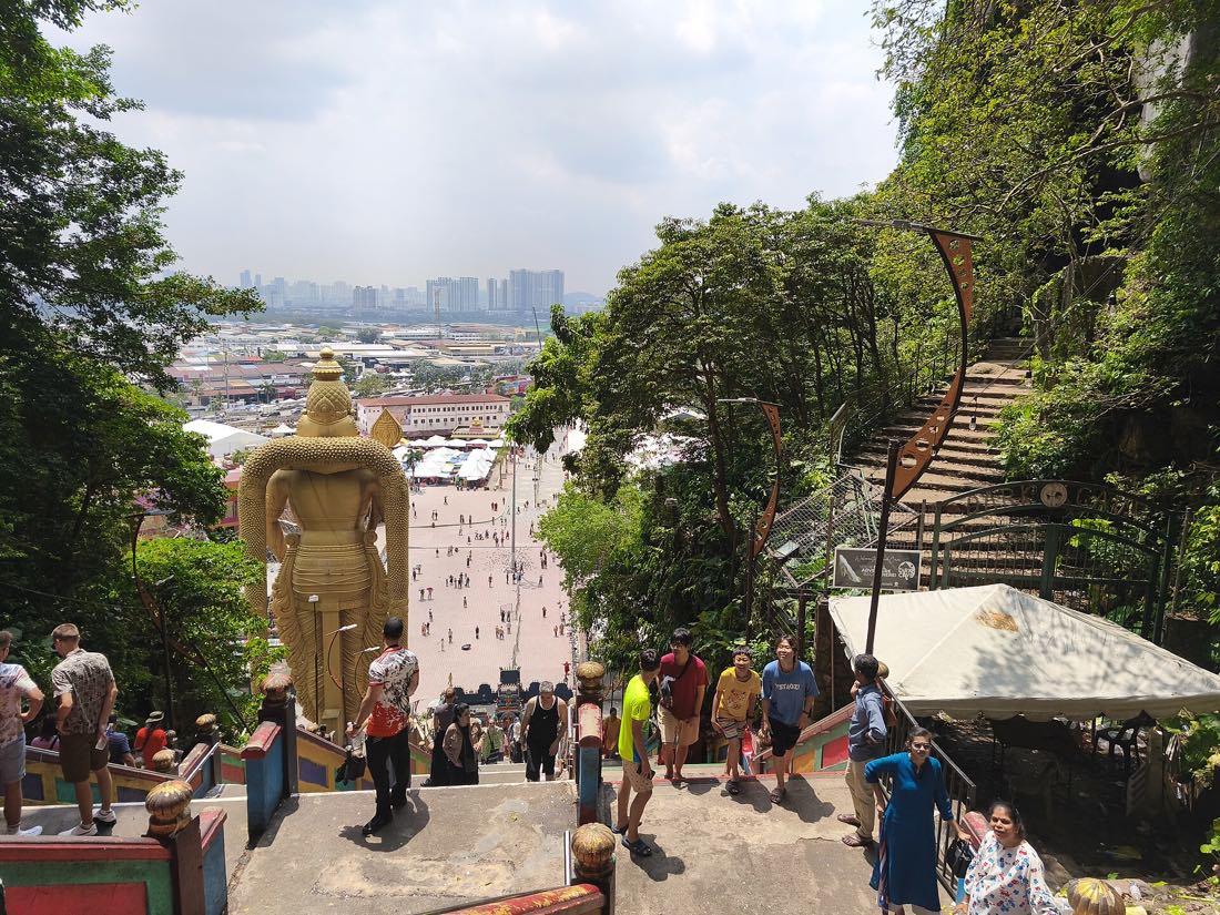 The gold Murugan statue and the painted staircase at Batu Caves